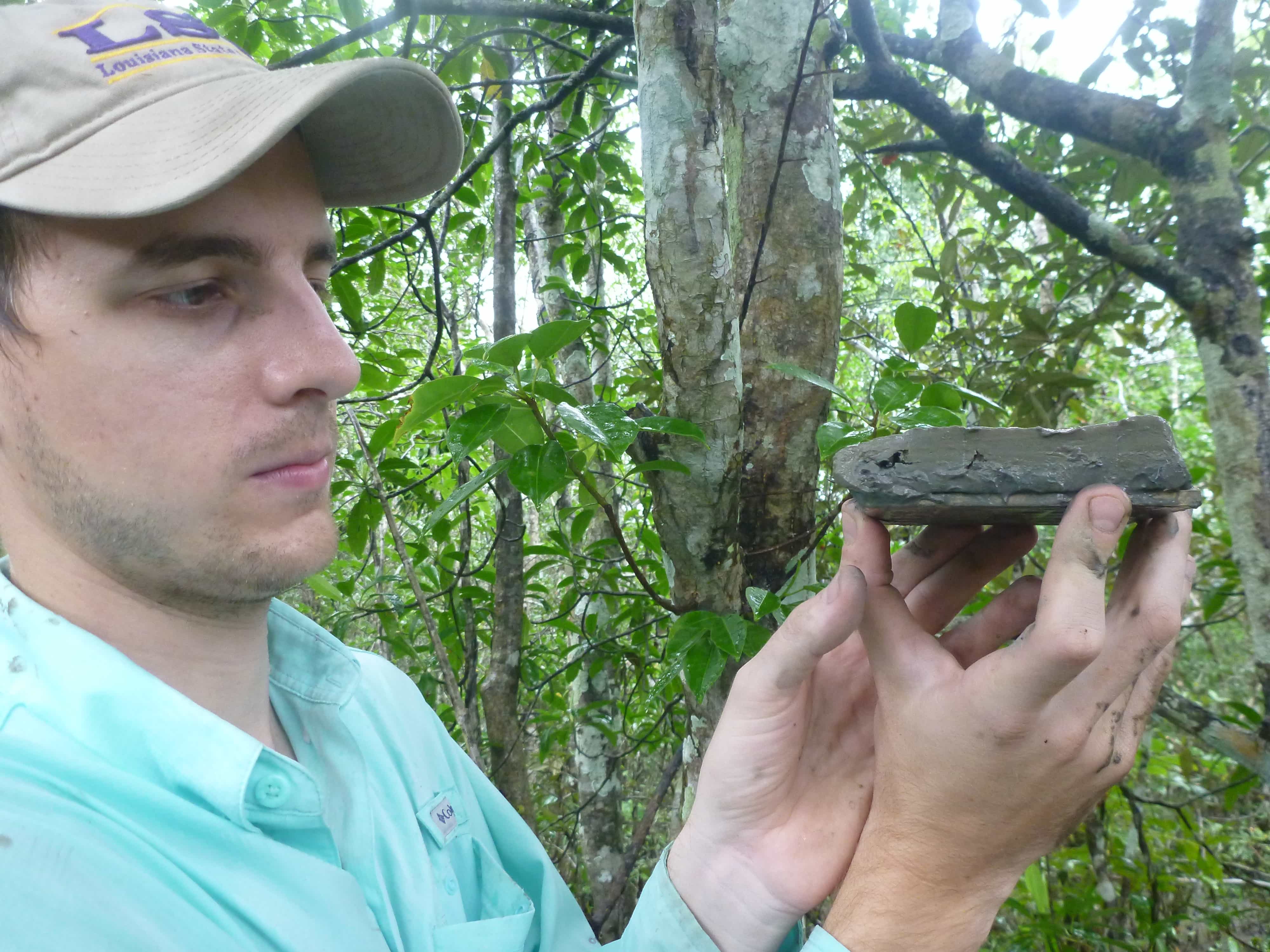 Student documenting monsoon sedimentation